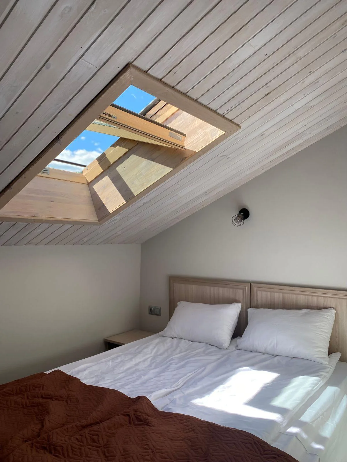Illustrative interior mood for loft conversions, not an Assembly project